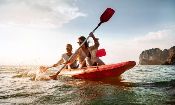 Couple in a kayak exploring the coastline