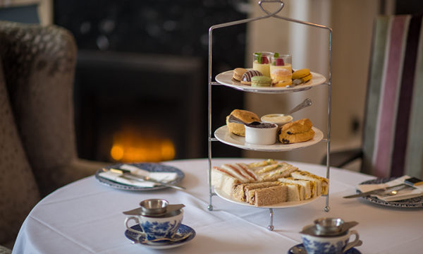 Imperial Hotel afternoon tea on table in front of roaring fire