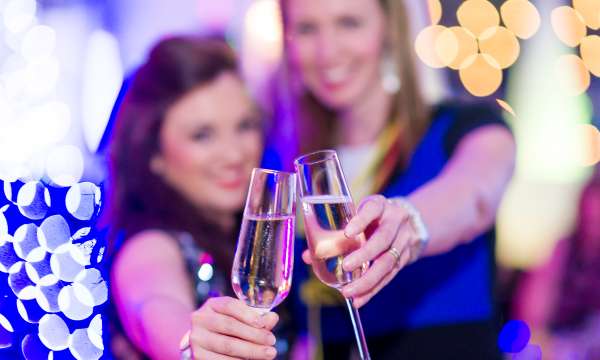 Christmas party woman toasting with champagne saunton sands