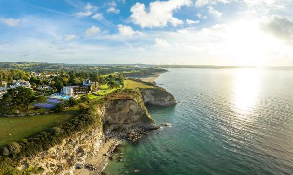 Carlyon bay hotel ariel view on cliff tops overlooking bay sunrise