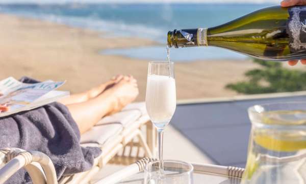 Pouring Prosecco on Saunton's rooftop terrace