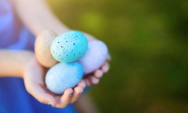 girl holding easter eggs