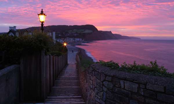 View of sidmouth beach at sunrise