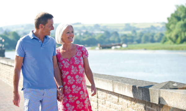 Couple walking along the River Taw in Barnstaple 