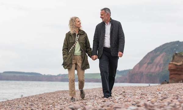 Couple walking on the beach