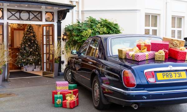 Rolls Royce at Hotel Entrance with Christmas Gifts 