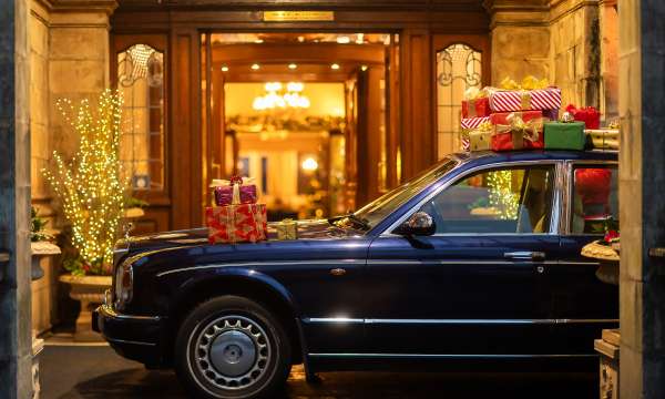 Rolls Royce at hotel Entrance with Christmas Gifts