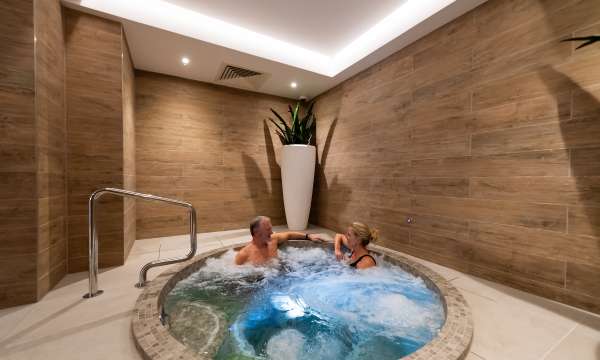 Couple in spa bath 