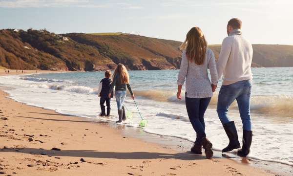 Family walking on beach