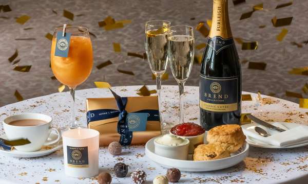 Cream Tea, Wine & Chocolates on table with confetti