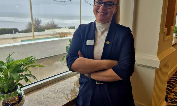 SAunton Sands Services Manager Ania standing by the window at Saunton Sands Hotel