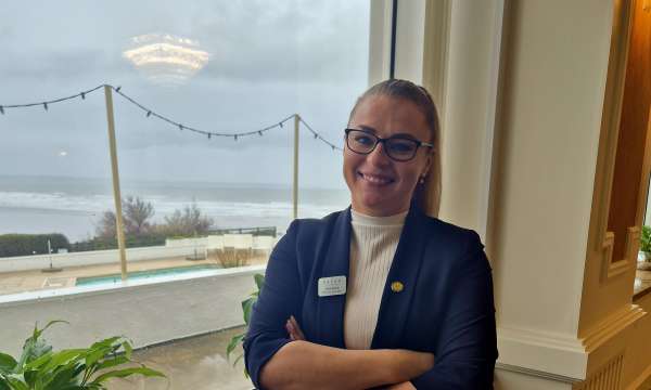 SAunton Sands Services Manager Ania standing by the window at Saunton Sands Hotel