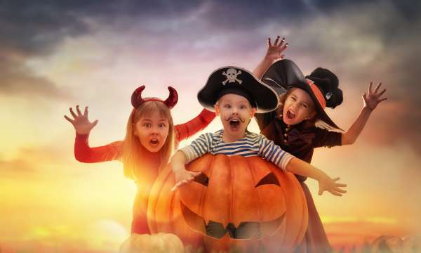 Halloween, Kids dressed up with a pumpkin 