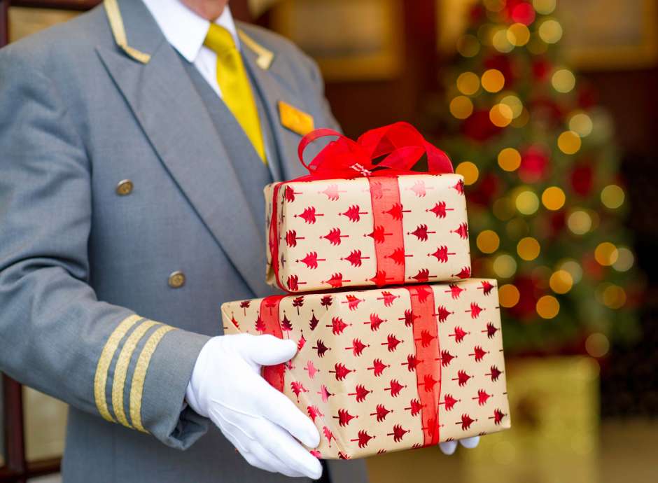 Carlyon Bay Hotel Doorman Carrying Christmas Presents