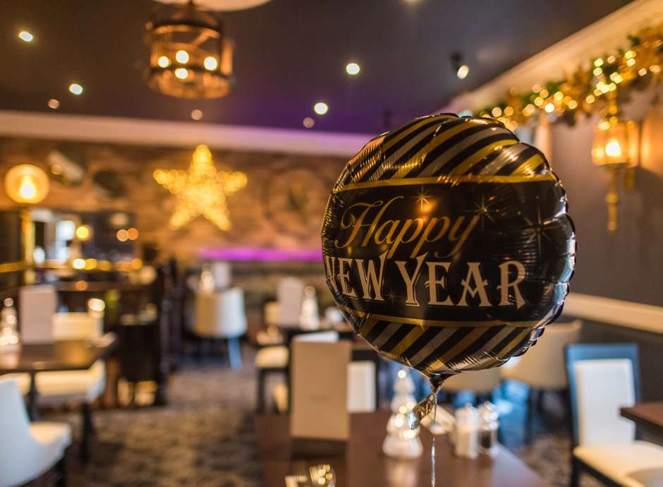 Devon Hotel Carriages Restaurant Decorated for Christmas with New Years Balloon