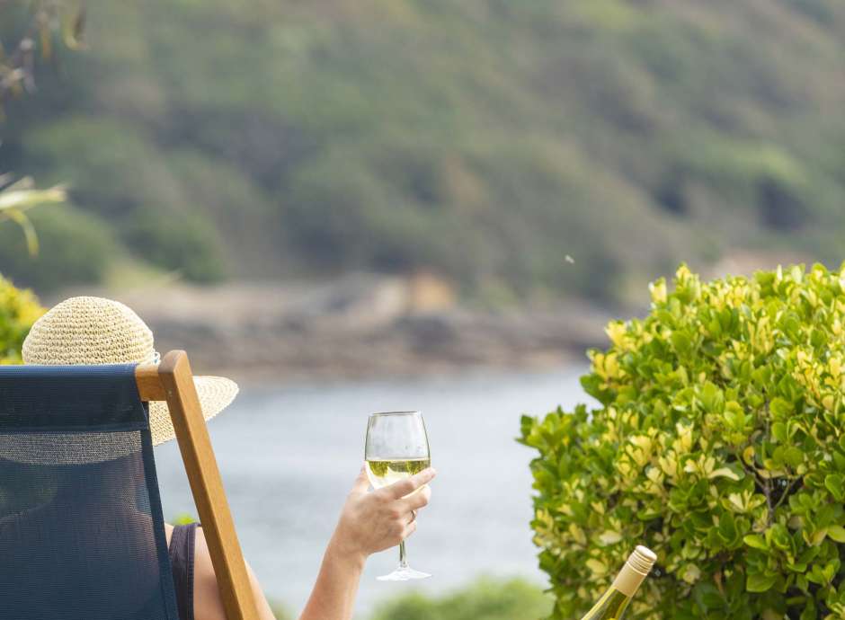 Royal Duchy Hotel Guest in Deck Chair with Wine Looking Out at Pendennis