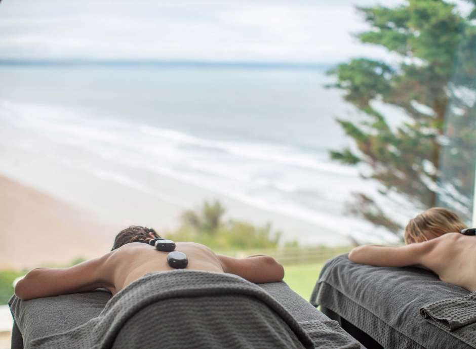 Saunton Sands Hotel Source Spa Guests Receiving Hot Stone Massages in Treatment Room