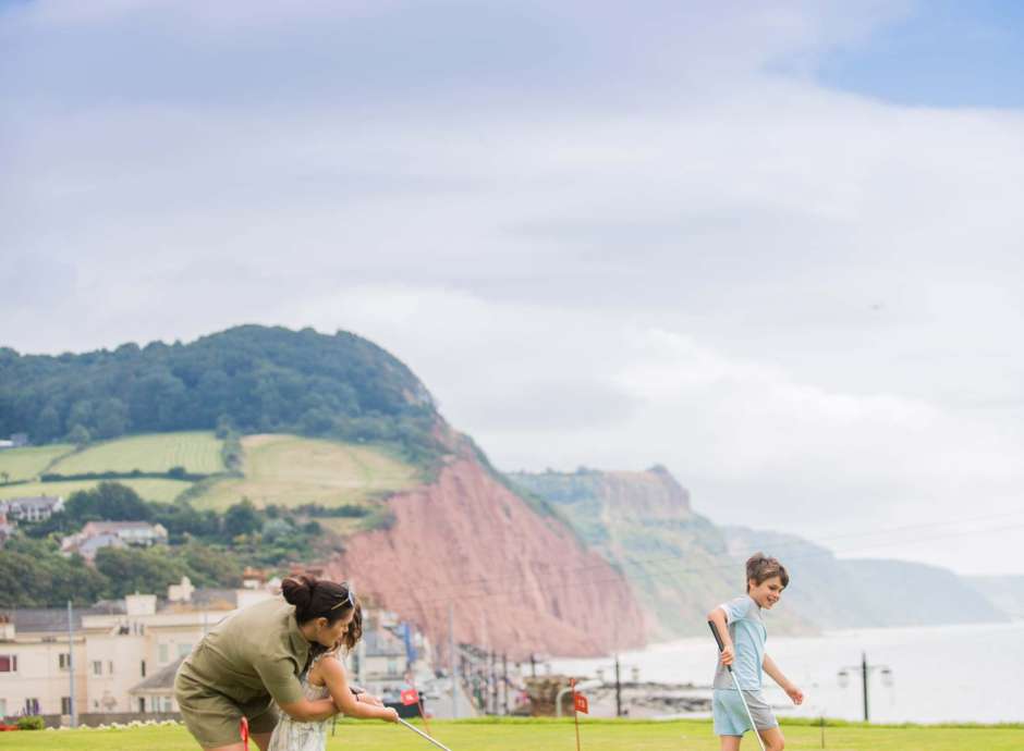 Victoria Hotel Mother and Children Enjoying a Game on the Putting Green