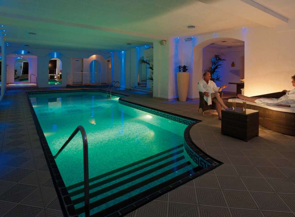 Victoria Hotel Couple Relaxing by Indoor Pool