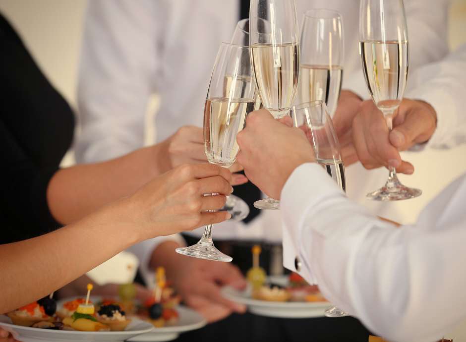 Wedding guests making a toast with champagne