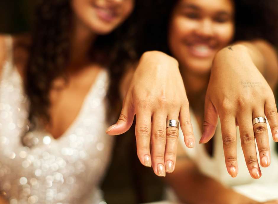 2 woman married hands with rings