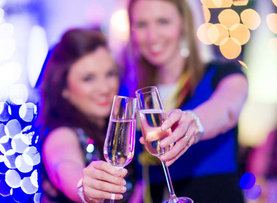 Christmas party woman toasting with champagne saunton sands