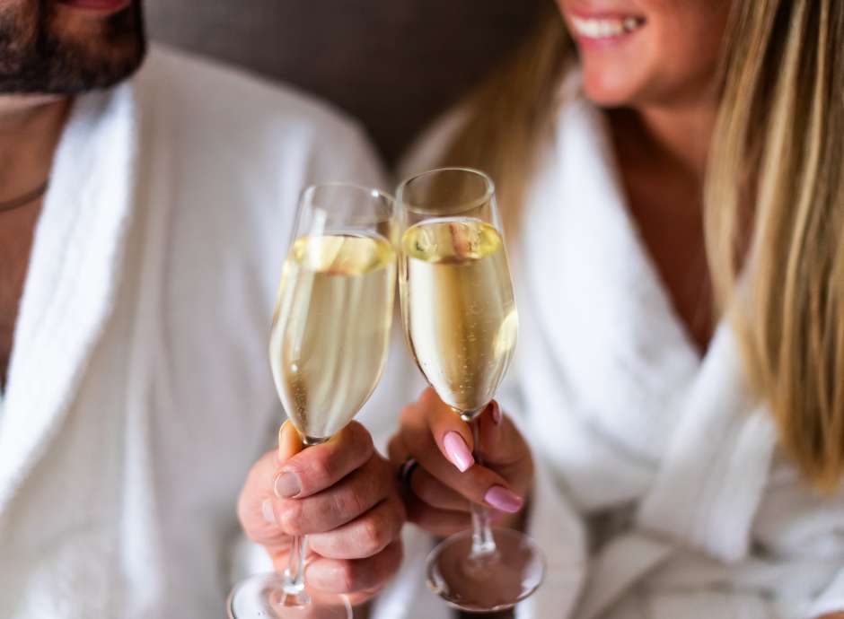 Couple saying cheers with prosecco