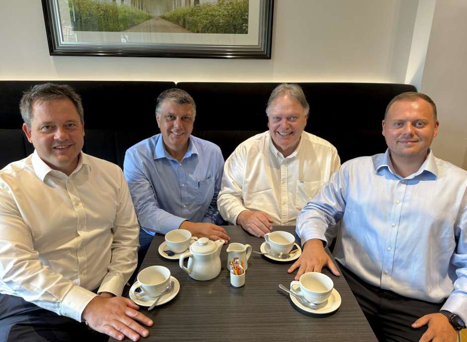 Brend Collection Directors at table