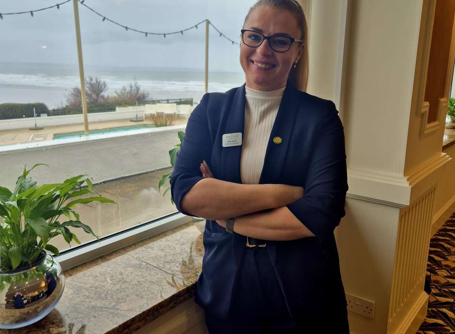SAunton Sands Services Manager Ania standing by the window at Saunton Sands Hotel