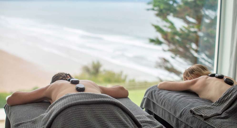 Saunton Sands Hotel Source Spa Guests Receiving Hot Stone Massages in Treatment Room