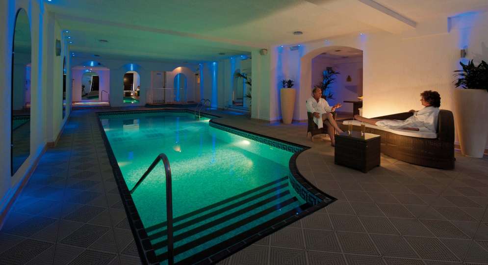 Victoria Hotel Couple Relaxing by Indoor Pool