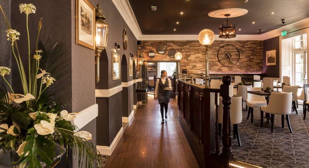 carriages restaurant waitress walking through at the devon hotel